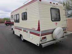 an rv is parked in a parking lot