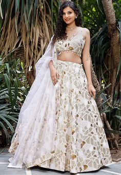 Faux Georgette Lehenga in White. This attire with Cotton Lining is Enhanced with Zari, Resham, Sequins Work along with Fancy Tassels and Potli. Available with a Readymade Faux Georgette White Choli and a Faux Georgette Dupatta in White. The Readymade skirt will be provided. Lehenga Length is 40 inched.Do Note: Accessories shown in the image are for presentation purposes only and length may vary upto 2 inches.(Slight variation in actual color vs. image is possible). We sell all kinds of Lehenga a White Choli For Diwali Party, White Festive Reception Sets, White Choli With Zari Work For Party, White Organza Choli For Navratri, White Resham Embroidered Choli For Parties, White Choli With Resham Embroidery For Party, White Organza Choli For Festive Occasions, White Resham Embroidery Choli For Party, Festive White Organza Choli