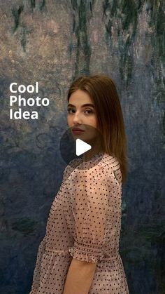 a woman standing in front of a painting with the words cool photo idea