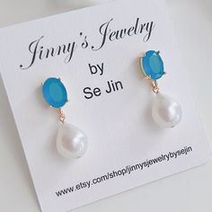 * DETAILS * - Freshwater Teardrop Shaped Pearls  - Capri Blue Sea Color Crystal Glass Post Earrings Metal: Bright / shiny gold plated brass ✨more earrings. www.Etsy.com/shop/JinnysJewelryBySeJin ------------------------------------------ * CARE TIPS * ⭐️TO PREVENT TARNISH: Keep your jewellery in airtight plastic bags. It won't tarnish if it isn't exposed to air. The worst place to leave your jewellery is in a steamy bathroom. Wipe with a soft cloth after wearing. - Perfumes: Be sure any perfume Sea Colour, Special Gifts For Her, Birthstone Earrings, Earrings Metal, Earrings Elegant, Capri Blue, Birthstone Earring, Plastic Bags, Blue Earrings