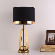 a table lamp with a black shade on it