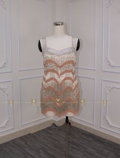 a dress on display in a room with white walls