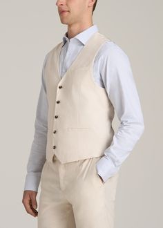 The Perfect Tall Men's Vest Elevate Your Ensemble Introducing our Stretch Linen Suit Vest, a classic wardrobe staple designed with the tall man in mind. This vest combines the timeless elegance of a tailored vest with the comfort of stretch linen, ensuring a flawless fit and enduring style. The pre-washed fabric guarantees minimal shrinkage, while the double welt pockets and button closure add a classic touch – just what you want in a tall men's jacket. Pair it with our Stretch Linen Dress Pants Linen Dress Pants, Scrubs Dress, Tailored Vest, Cozy Sleepwear, Tall Man, Mens Suit Vest, Tall Men, Linen Suit, Classic Wardrobe