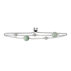 Jade of Yesteryear Sterling Silver Green Jade Adjustable Bracelet Pretty polished jade beads scattered throughout this multi-chain, adjustable bracelet, will bring a touch of sophisticated gemstone color to any outfit.       Approx. 9"L x 3/8"W     Stamped .925 sterling silver; rhodium plated     Adjustable slide clasp     Two strands of doubled oval-link chain with round, green jade bead accents accross top     Wheat chain completes bracelet   Stone Information       All sizes and weights appro Adjustable Jade Beaded Chain Jewelry, Adjustable Silver Jade Crystal Bracelet, Adjustable Chain Bracelet With Round Beads And Extender, Adjustable Round Beads Chain Bracelet With Extender, Bracelet Stone, Color Bands, Chain Design, Jade Jewelry, Jade Beads