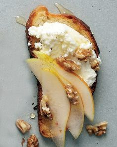 an apple and goat cheese sandwich with walnuts