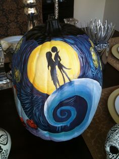 a painted pumpkin with a couple on it