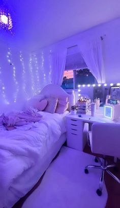 a bedroom decorated in white and purple lights