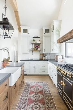 Are you looking for two tone kitchen cabinet ideas and color combinations? Then you'll love this post that shows how this design trend has evolved for 2024, plus lots of beautiful two tone color combinations such as green, black, blue, white and natural wood. Beautiful White Kitchens, Lighting Farmhouse, Two Tone Kitchen Cabinets, Refacing Kitchen Cabinets, Farmhouse White, Black Countertops, Two Tone Kitchen, Fixer Upper Style, New Kitchen Cabinets