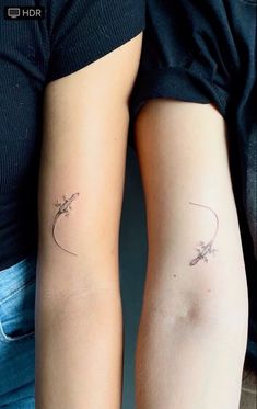 two people with tattoos on their arms and one has a flower tattoo on the arm