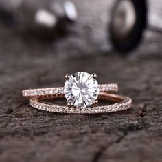 a close up of a ring with a diamond on it