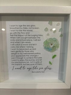 a framed poem in a white frame with green flowers and leaves on the bottom side