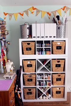 a white shelf filled with lots of crafting supplies