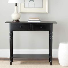 a black table with two drawers and a lamp on top