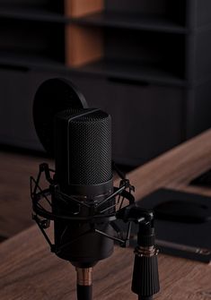 a microphone sitting on top of a wooden table