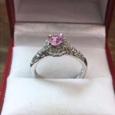 New Cubic Zirconia Handset Engagement Ring 14k White Gold Layer On Solid .925 Sterling Silver Size - 7.75 Top Width : 0.35" Inches (8.9 Mm) Top Height : 0.35" Inches (8.9 Mm) This Ring Can Be Resize Please Message Us If You Need Resizing Before You Buy . Free Gift Box Plus Don't Forget To Follow Us On Facebook, Instagram, Twitter, And Youtube . Thanks Item # Jn03261753-S-053 Pink Cluster Ring With Round Cut For Gift, Pink Sterling Silver Diamond Ring With Accent Stones, Pink Diamond Accented Promise Rings, Pink Diamond Cluster Ring As A Gift, Pink Diamond Accents Promise Rings, Pink Rings With Diamond Accents For Promise Occasion, Pink Cluster Ring With Round Cut For Anniversary, Pink Diamond Halo Ring As Gift, Pink Rings With Diamond Accents For Promise