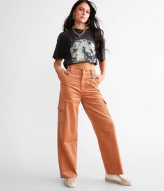 KanCan Signature 90s Cropped Wide Leg Corduroy Cargo Pant - Orange 26/28, Women's Sherry Ultra high rise Slightly fitted through the hip and thigh 15 bottom opening Frayed hem. This quality denim is hand-finished for a unique look. It will wear like your favorite jeans, with each hole and tear continuing to destruct over time. You will love the comfort of this denim that has the look and feel of years of wear. . 97% Cotton 3% Spandex. Machine wash cold with like colors inside out. Do not bleach. Orange Baggy Pants Outfit, Cool Barista Outfit, Orange Corduroy Pants Outfit, Corduroy Pants Outfit Aesthetic, Orange Jeans Outfit, Burnt Orange Pants Outfit, Rust Pants Outfit, Orange Cargo Pants Outfit, Wide Leg Cargo Pants Outfit