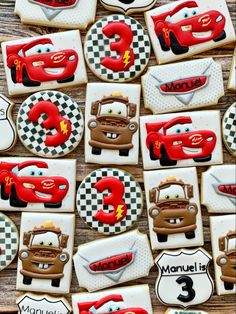 decorated cookies with cars and numbers on them