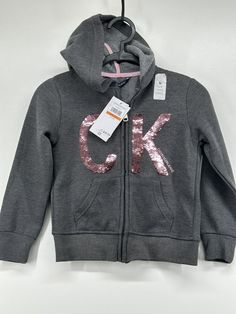 Calvin Klein Sequin logo CK Full Zip Hoodie Girls hearher charcoal flip Size S brand new with tag Cx200 Calvin Klein Outfits, Hoodie Girl, Full Zip Hoodie, Zip Hoodie, Calvin Klein, Sequin, Brand New, ? Logo, Clothes