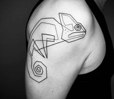 a black and white photo of a woman's shoulder with geometric shapes on it