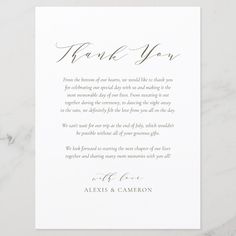 a white thank card with the words, thank you written in cursive writing