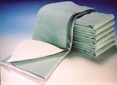 a stack of folded sheets sitting on top of each other