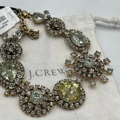 J.Crew White And Cream Starburst Crystal Rhinestone Necklace $44.99* Faceted Prong Set Brand Color - White, Soft Yellow Crystals Length - Adjustable- 17.5 Inch(18.5 Inch- 19.5 Inch Size - Starburst- 1.5" Diameter Large Circle- 1" Diameter, Small Circle-0.75" Diameter Large Teardrop-1.5"(L) X 1" (W), Small Teardrop- 1"(L) X 0.75"(W) Clasp Style - Lobster Claw With A Small Round Gold Tone J.Crew Logo Tag New With Tags Elegant Yellow Jewelry With Rhinestones, Pave Heart Necklace, Yellow Crystals, Brass Pendant Necklace, Green Statement Necklace, Pink Statement Necklace, Stone Statement Necklace, Statement Collar Necklace, Gold Long Necklace