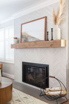 a living room with a fireplace and white walls