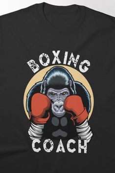 Bold t-shirt design featuring a powerful boxing gorilla illustration with the text 'Boxing Coach,' perfect for coaches and boxing enthusiasts. This cool and unique graphic showcases strength and determination, making it a great choice for anyone passionate about the sport. Gorilla Illustration, Text Cool, Boxing Coach, Cool Design, Boxing, Coaching, Cool Designs