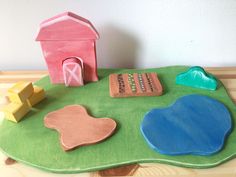 a play mat with wooden toys on it