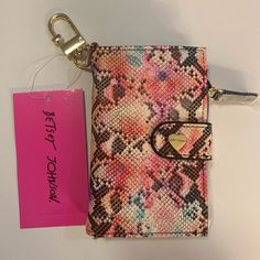 Betsey Johnson Snake Print Wallet With Key Ring Gold Tone Hardware Snap Closure 1 Id Slot 4 Credit Card Slots 2 Open Pockets 1 Zipper Coin Pocket Measurements: Approximately (Closed) 3x5x.75 Inches (Open) 6.75x5 Inches #1 Trendy Pink Coin Purse For Everyday Use, Trendy Multicolor Card Holder For Daily Use, Trendy Pink Everyday Coin Purse, Trendy Pink Bifold Coin Purse, Trendy Multicolor Pouch Wallet, Trendy Multicolor Wallets With Interior Card Slots, Trendy Multicolor Wallet With Zipper Closure, Trendy Multicolor Wallets With Zipper Closure, Multicolor Coin Purse With Zipper Closure