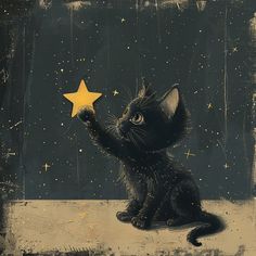 a black cat holding a yellow star in its paws