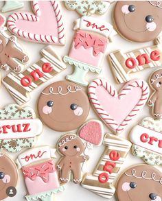 decorated cookies are arranged in the shape of hearts, teddy bears, and other items