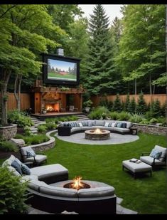 a backyard with a fire pit, seating and television in the back yard is surrounded by lush green trees