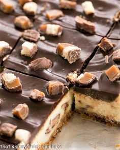 a close up of a cake with chocolate and marshmallows on it's crust