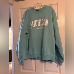 Brand New Michigan Crewneck Hoodie Blue Trendy Blue Long Sleeve Sweatshirt, Blue Sweatshirt For Fall Loungewear, Trendy Blue Sweatshirt For Fall, Trendy Light Blue Winter Sweatshirt, Casual College Hoodie Sweater, Blue Casual Sweatshirt With Ribbed Cuffs, Casual Blue Letter Print Sweater, Casual Blue Sweatshirt With Ribbed Cuffs, Light Blue Relaxed Fit Sweatshirt For Winter