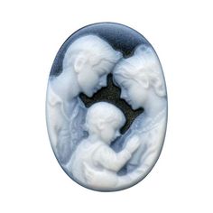 an image of a button with two cherubs in the shape of a mother and child