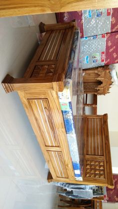 a wooden cabinet sitting on top of a hard wood floor