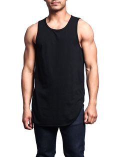 a man in black tank top posing for the camera