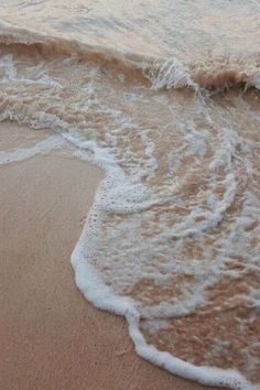 the waves are coming in to the shore line on the beach, and there is no image here