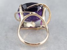 Modernist. Bold. Classic. This ring could have graced the hand of a New York fashionista partying alongside Warhol, back in the day. We've set a new, incredibly deep colored, fine amethyst from Zambia in its swirling golden cage. Metal: 14K Yellow Gold Gem: Amethyst 17.73 Carats Gem Measurements: 19.4 mm, Round Ring Size: 5.50 Marks: "14K" Stamped on the inside band Golden Cage, Yellow Gold Sapphire Ring, Amethyst Cocktail Ring, Right Hand Ring, Modernist Ring, Cameo Ring, Right Hand Rings, Hand Ring, Purple Band