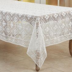 a white table cloth on top of a wooden chair