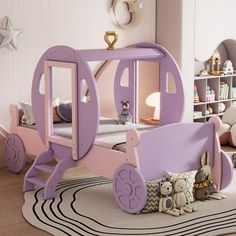 a child's bedroom with a pink and purple carriage bed in the middle, along with bookshelves