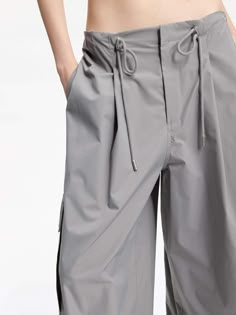 MO&Co. Women's Drawstring Detail Cargo Pants Made with breathable material, these pants feature a wide-leg cut and a drawstring waistband for a perfect fit. With multiple pockets, they are both functional and stylish. Pair them with our short cut T-shirt for a casual yet fashionable look. Features : - Wide leg cut, drawstring waistband- Concealed button, hook, and zipper closure- Multi pockets on the sides- UPF 40+ sun protection Code: MBD1PAT032The back length of size M is 106cmMATERIALS & CARE Cargo Pants Pockets, Casual Cargo Pants, Drawstring Detail, Pastel Grey, Cut T Shirt, Short Cut, Cut Tshirt, Mesh Bag, Short Cuts