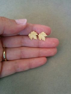 A beautiful simple leaf stud earrings.Made of 24k gold plated brass base, matte finish.Dimensions: Length:          0.3 inch       1  cm Width:            0.3 inch       1 cmItem will be shipped in a branded gift box.To continue shopping, check out my Etsy store:https://www.etsy.com/shop/HilaAssaJewelryFor more stud earrings click here:https://www.etsy.com/shop/HilaAssaJewelry?ref=hdr_shop_menu§ion_id=19015107For more earrings click here:https://www.etsy.com/shop/HilaAssaJewelry?section_id=17717 Minimalist Gold Leaf Earrings, Gold Leaf Earrings For Gift, Gold Leaf-shaped Earrings For Gift, Everyday Gold Leaf-shaped Jewelry, Everyday Gold Leaf Jewelry, Yellow Gold Leaf-shaped Earrings For Pierced Ears, Yellow Gold Leaf Earrings, Gold Earrings Studs Simple, Fall Earring