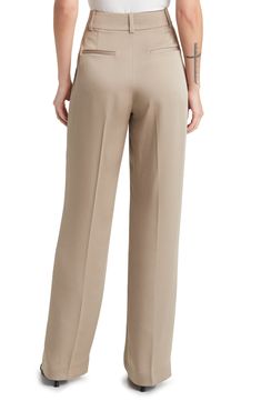 Chic for the office or a night out, these wide-leg trousers are fashioned from smooth woven fabric and pleated at the superhigh waist to further the flowy fit. 32" inseam; 20" leg opening; 13 1/2" front rise; 16" back rise (size 8) Zip fly with hook-and-bar closure Front slant pockets; back welt pockets 100% polyester Machine wash, tumble dry Imported Beige Straight Leg Pantsuit For Formal Occasions, Elegant Wide Leg Pants With Loosely Fitted Hips, Beige Straight Leg Formal Pantsuit, Beige Formal Straight Leg Pantsuit, Office Wide Leg Pants With Elastic Waistband, Elegant Relaxed Fit Full-length Bottoms, Solid Wide Leg Dress Pants With Pressed Crease, Beige Wide Leg Pants For Office, Beige Wide Leg Office Pants