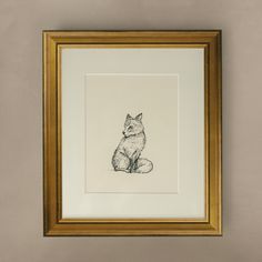 a black and white drawing of a fox sitting in front of a framed wall hanging