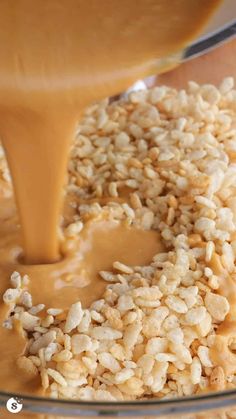 a glass bowl filled with oatmeal and caramel being poured into it