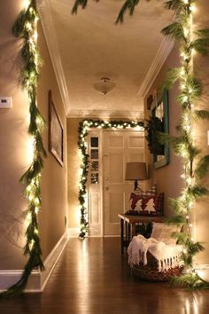 the hallway is decorated for christmas with garland and lights