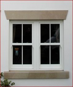 an image of a cat sitting on the window sill