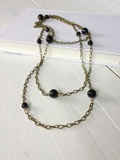 Long Chain Wrap Necklace Black Onyx Stones Vintage Style Chain Black Metal Long Necklace As A Gift, Black Double Strand Necklace With Black Beads, Black Double Strand Necklace With Beads, Black Metal Long Necklace For Gift, Black Chain Necklace With Round Beads For Gift, Black Round Beads Chain Necklace As Gift, Black Wire Wrapped Necklaces For Jewelry Making, Black Metal Double Chain Necklace, Vintage Black Beaded Chain Necklace